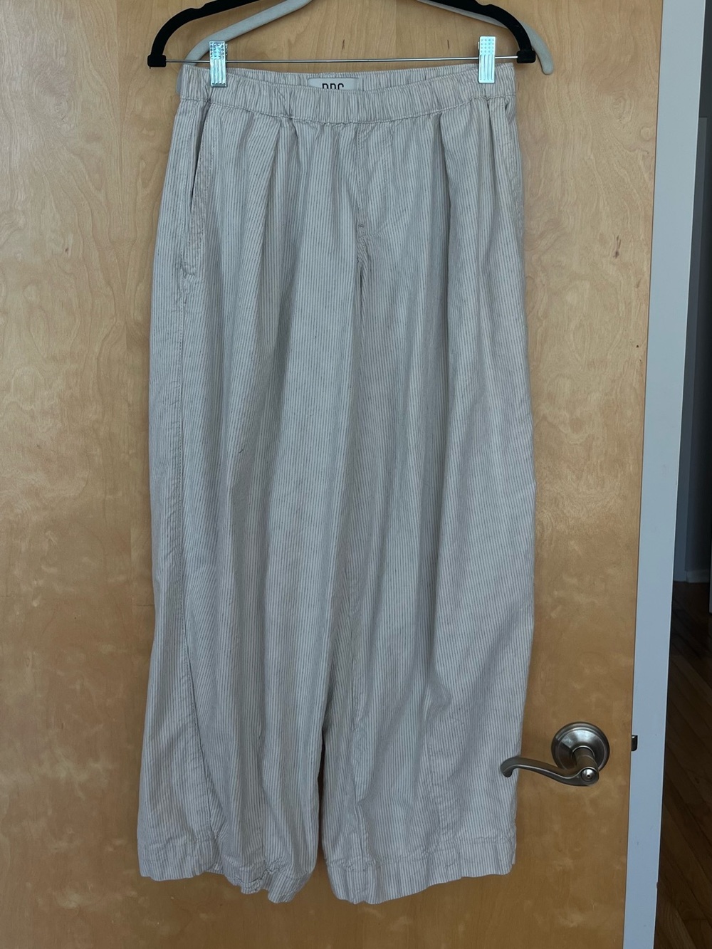 BDG women’s low waisted baggy cotton pinstripe pants